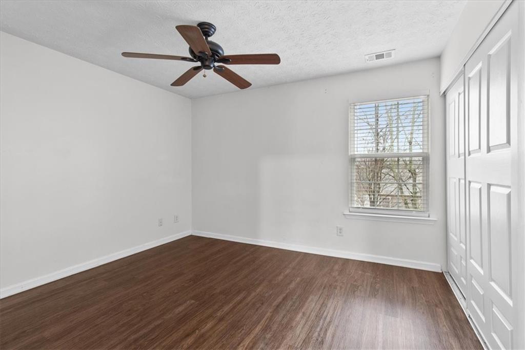 307 Meadows Lane Canton, GA 30114 - Photo 24 of 33 wooden floor in an empty room with a window