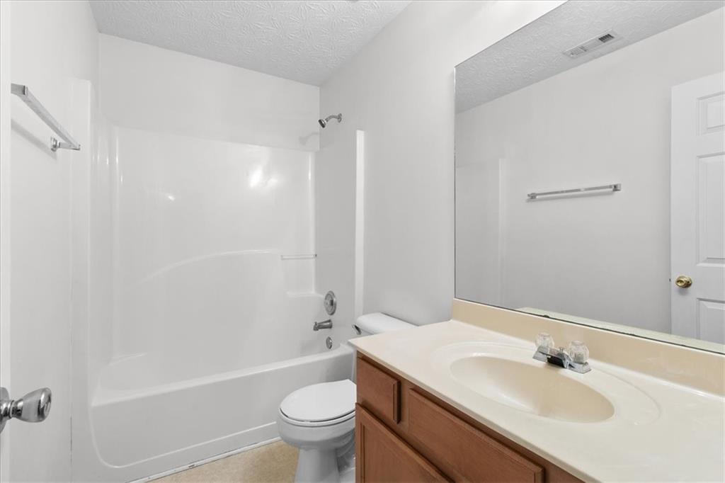307 Meadows Lane Canton, GA 30114 - Photo 25 of 33 a bathroom with a sink toilet and shower