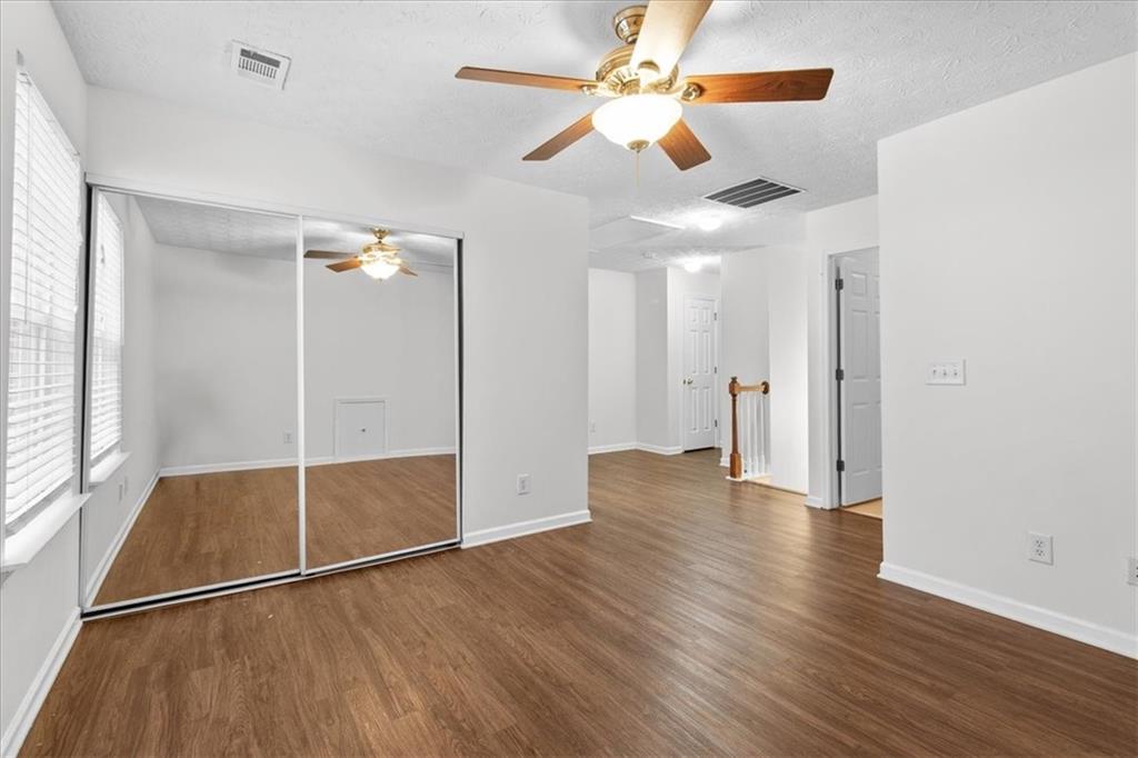307 Meadows Lane Canton, GA 30114 - Photo 28 of 33 a view of an empty room with wooden floor