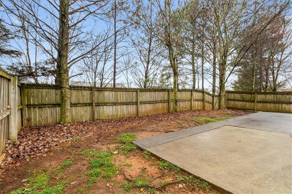 307 Meadows Lane Canton, GA 30114 - Photo 31 of 33 a view of a yard with large trees