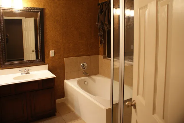 a bathroom with a bathtub and a sink