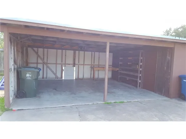 a view of a backyard with a small cabin