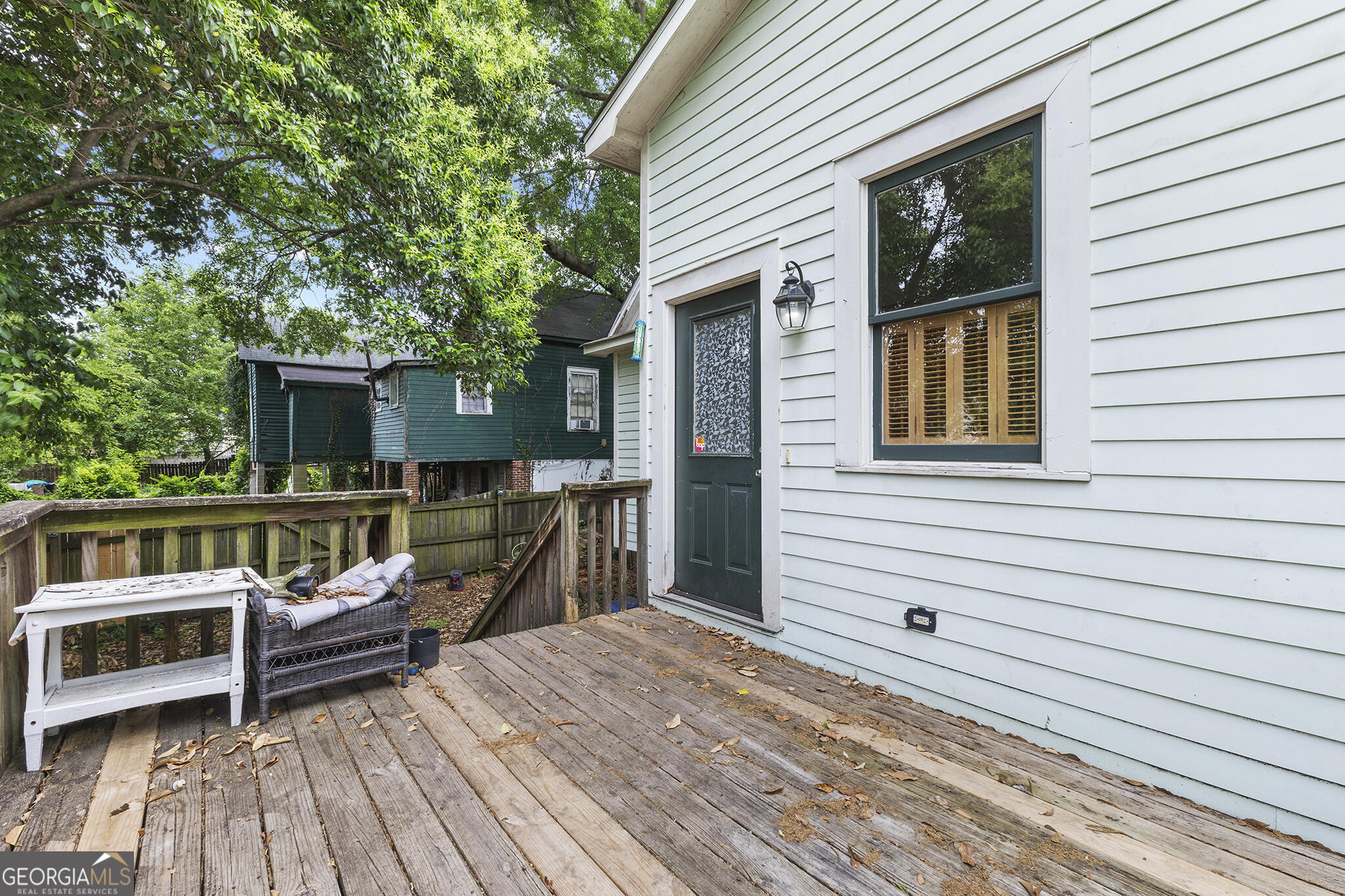 1469 Chestnut Street Macon, GA 31201 - Photo 23 of 26 a view of a house with a deck and furniture