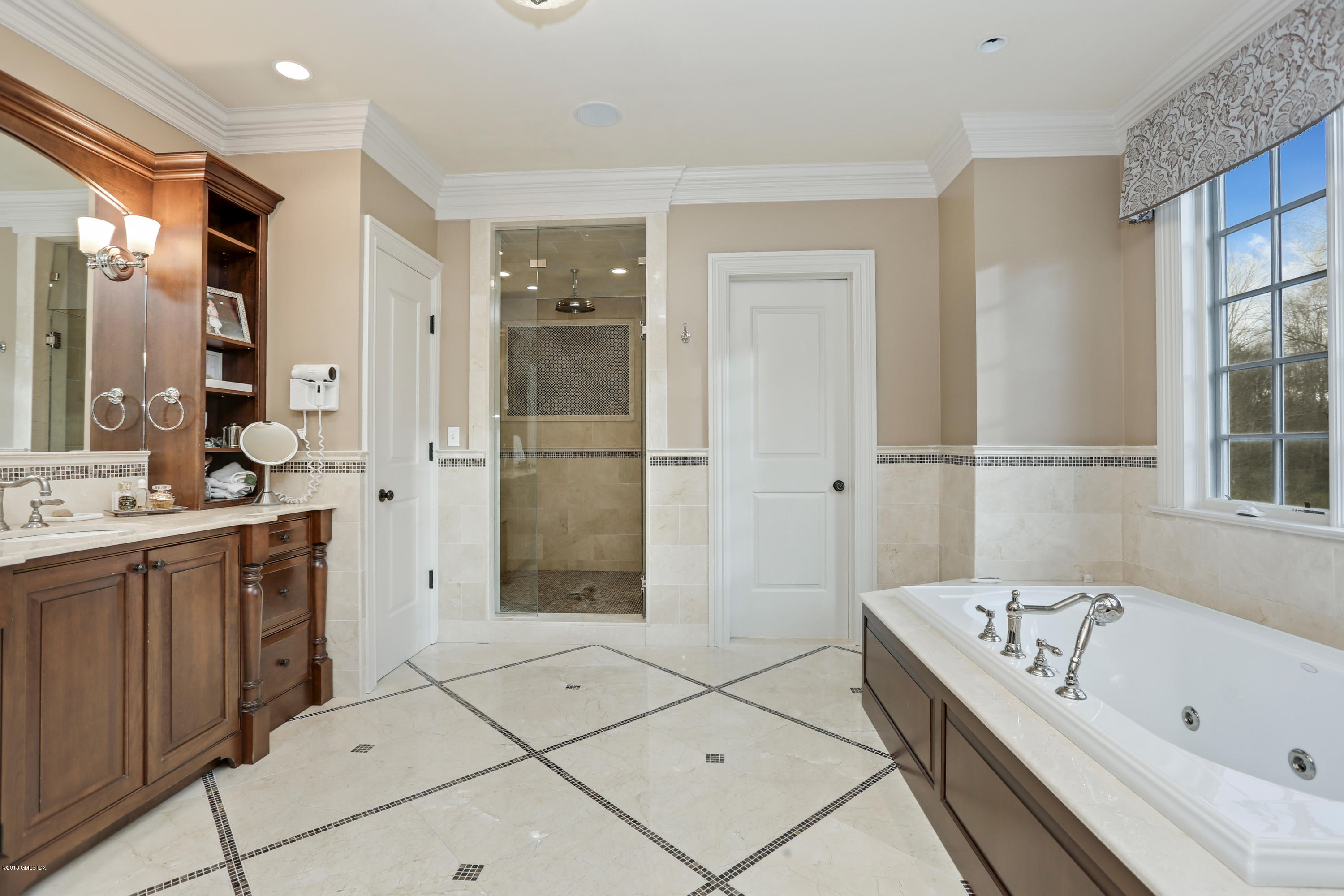 10 Andrews Road Greenwich, CT 06830 - Photo 15 of 29 a bathroom with a bathtub and a shower