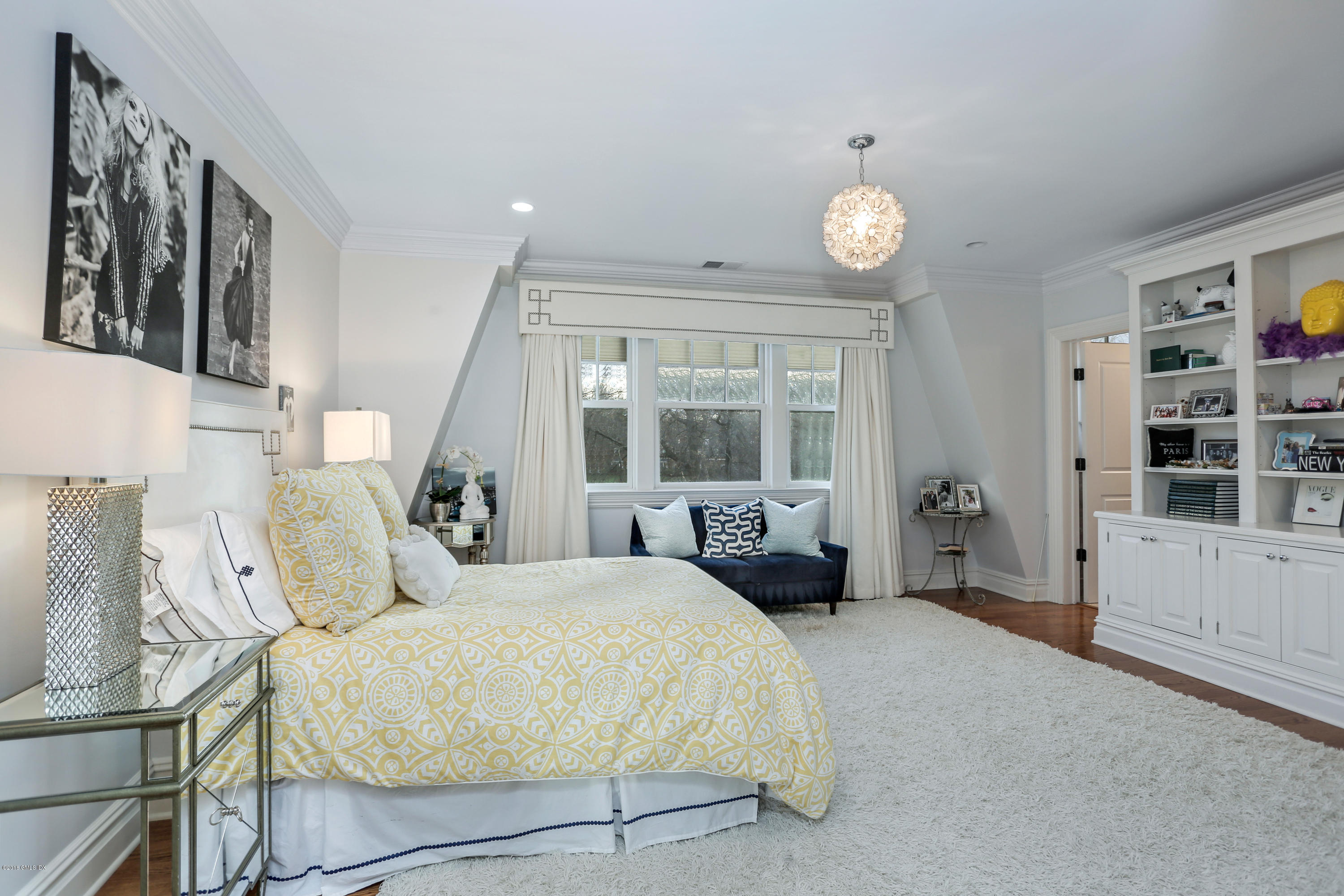10 Andrews Road Greenwich, CT 06830 - Photo 16 of 29 a spacious bedroom with a bed and a window