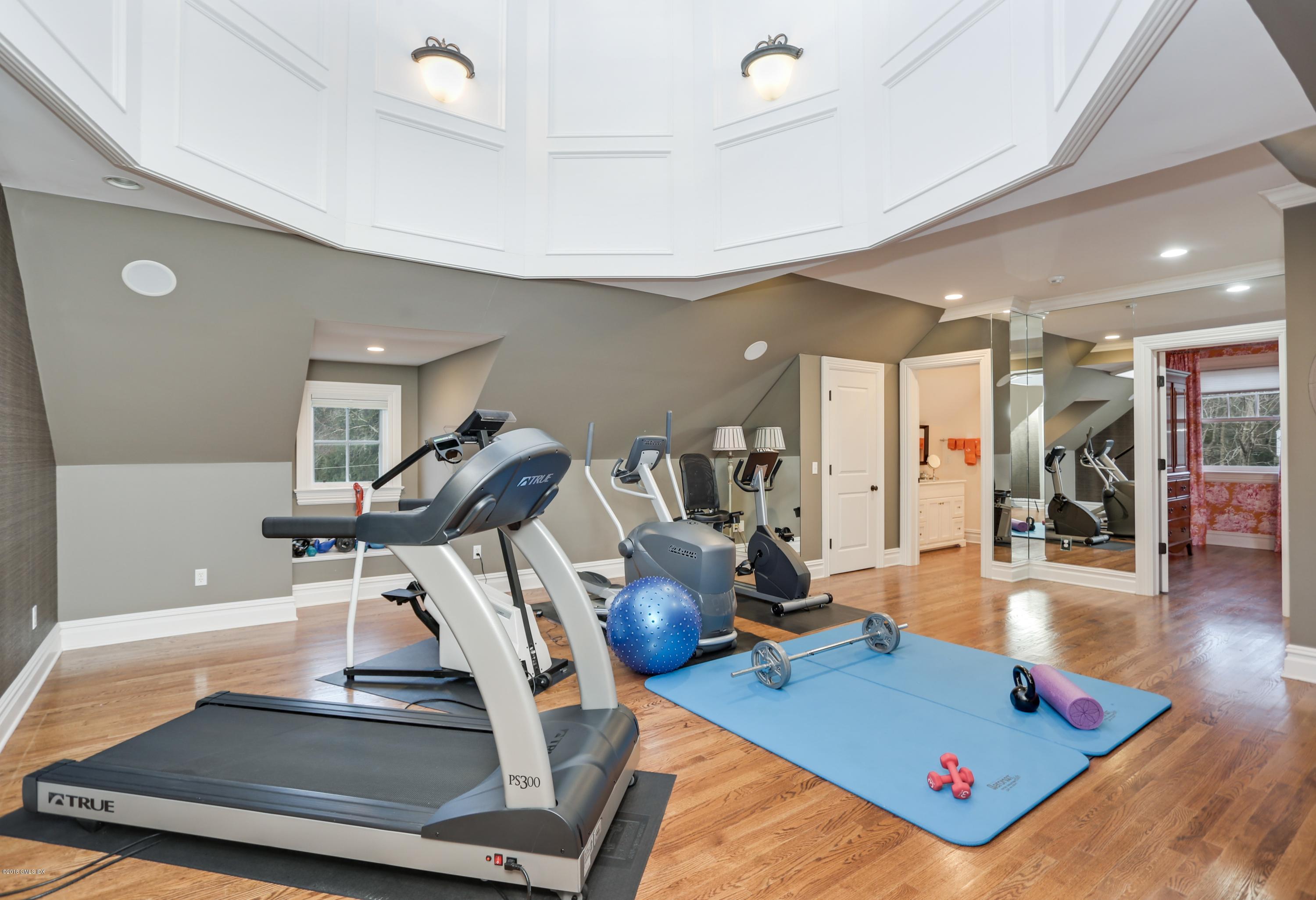 10 Andrews Road Greenwich, CT 06830 - Photo 20 of 29 a room with gym equipment and view of living room