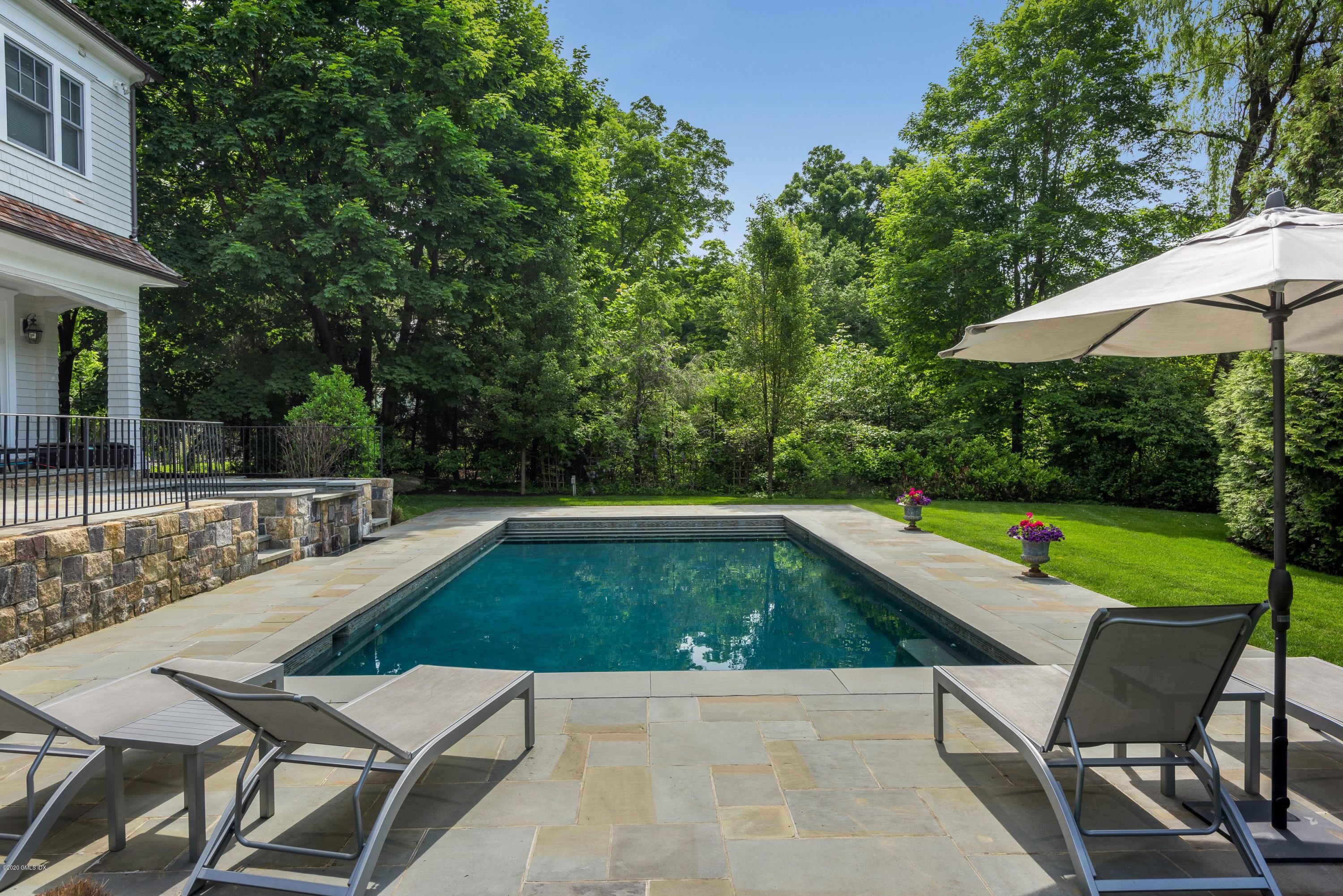 10 Andrews Road Greenwich, CT 06830 - Photo 22 of 29 a view of swimming pool with chairs