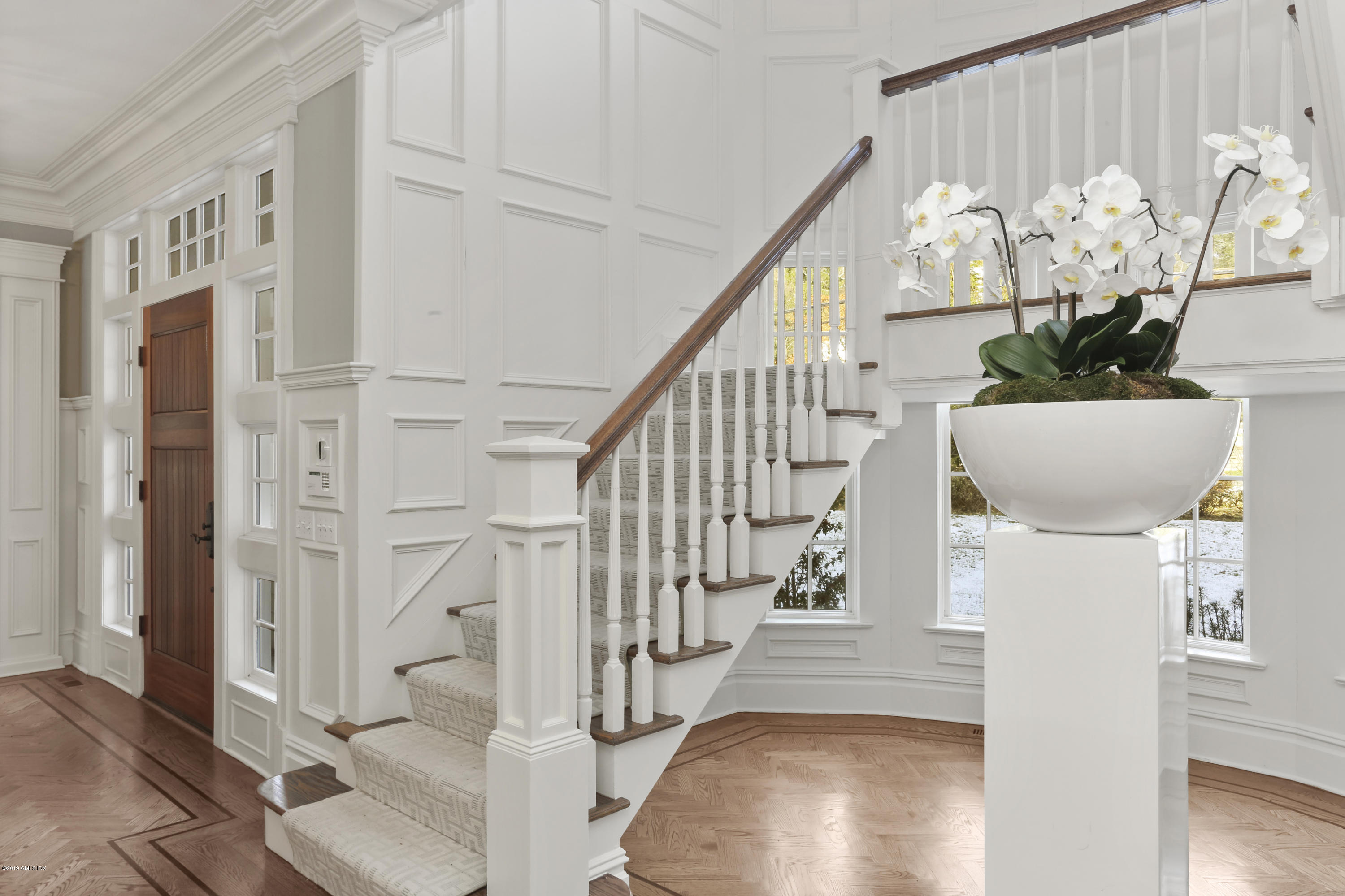 10 Andrews Road Greenwich, CT 06830 - Photo 5 of 29 a view of entryway and hall with wooden floor
