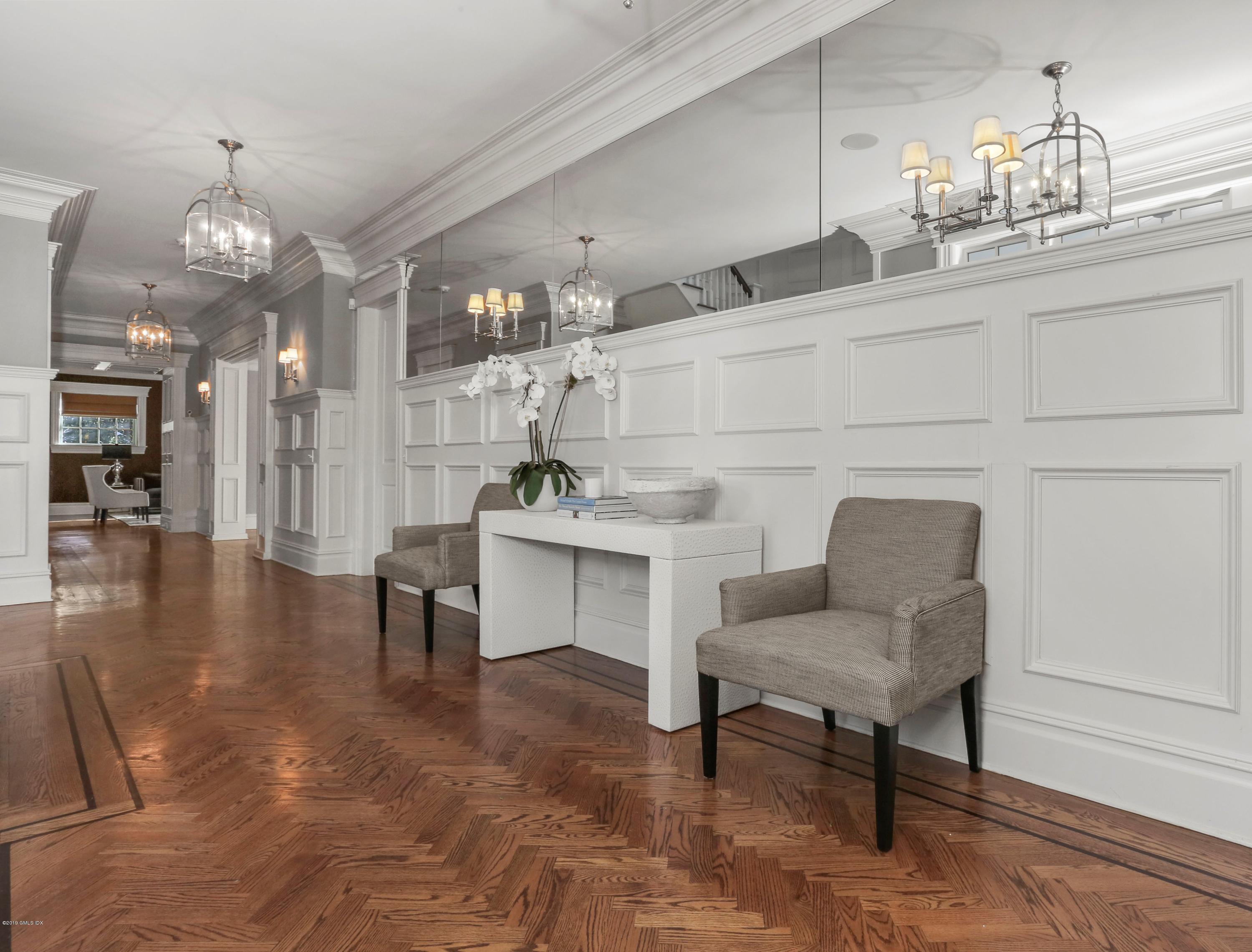 10 Andrews Road Greenwich, CT 06830 - Photo 6 of 29 a living room with furniture and a chandelier