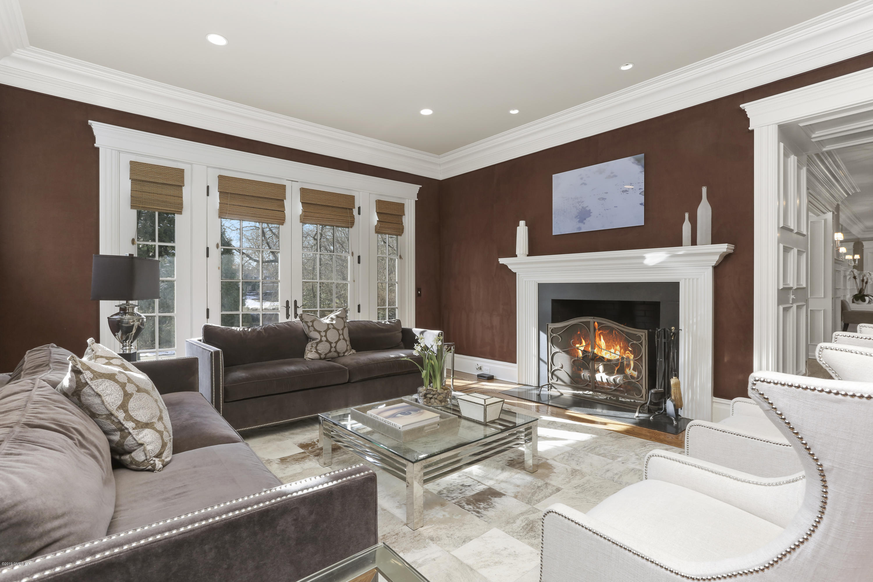 10 Andrews Road Greenwich, CT 06830 - Photo 10 of 29 a living room with furniture and a fireplace