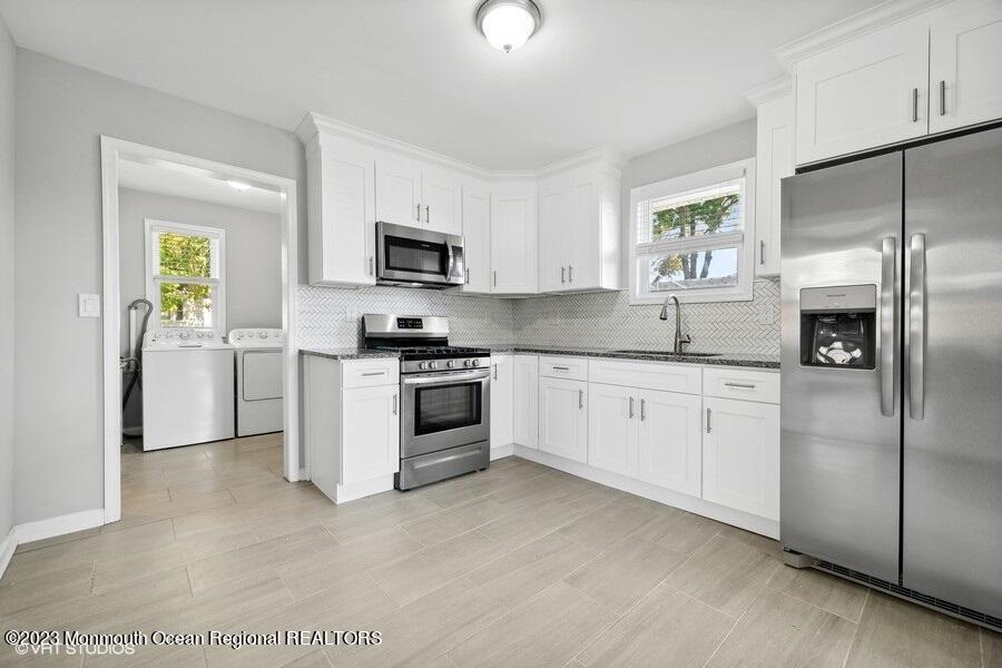 3 Monroe Street Keyport, NJ 07735 - Photo 7 of 16 a kitchen with cabinets stainless steel appliances and a window