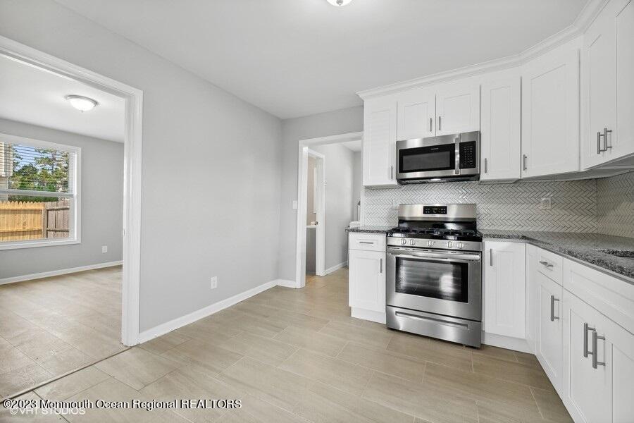3 Monroe Street Keyport, NJ 07735 - Photo 9 of 16 a kitchen with granite countertop a sink and steel appliances