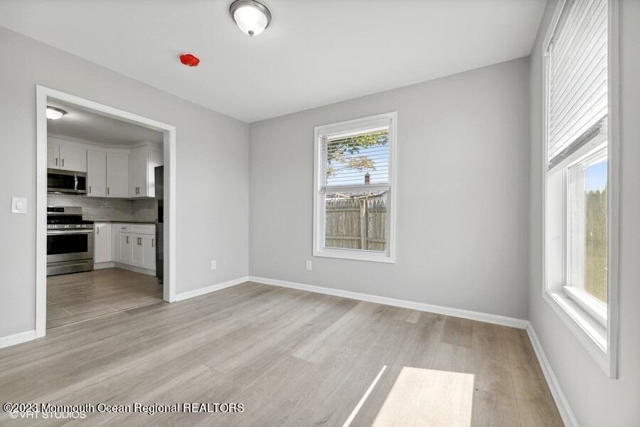 3 Monroe Street Keyport, NJ 07735 - Photo 10 of 16 wooden floor in an empty room with a window