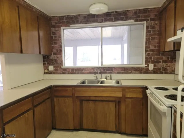 a kitchen with a stove and a refrigerator