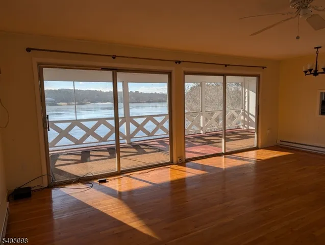 an empty room with wooden floor