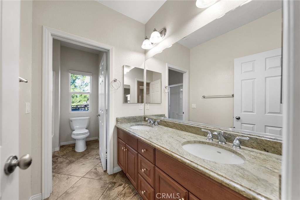 28889 Edenton Way Temecula, CA 92591 - Photo 29 of 56 SEcondary bathoom with granite counters and dual sinks.