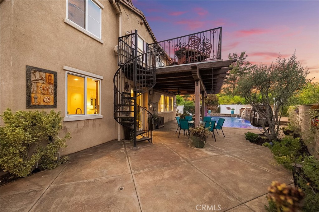 28889 Edenton Way Temecula, CA 92591 - Photo 37 of 56 Private balcony and view of patio area and pool