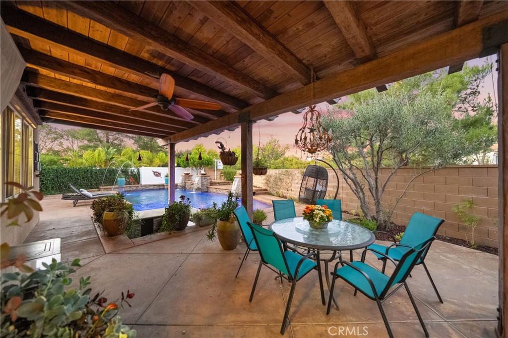 28889 Edenton Way Temecula, CA 92591 - Photo 38 of 56 Stunning patio with heavy wood beams, ceiling fan and feels like you are in the lap of luxury.