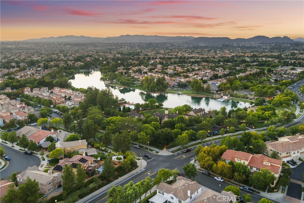 28889 Edenton Way Temecula, CA 92591 - Photo 47 of 56 Harveston with it's 18 acre lake and Endenton Way home view across from Clubhouse, walking trials, play grounds, sports park and even paddle boats!