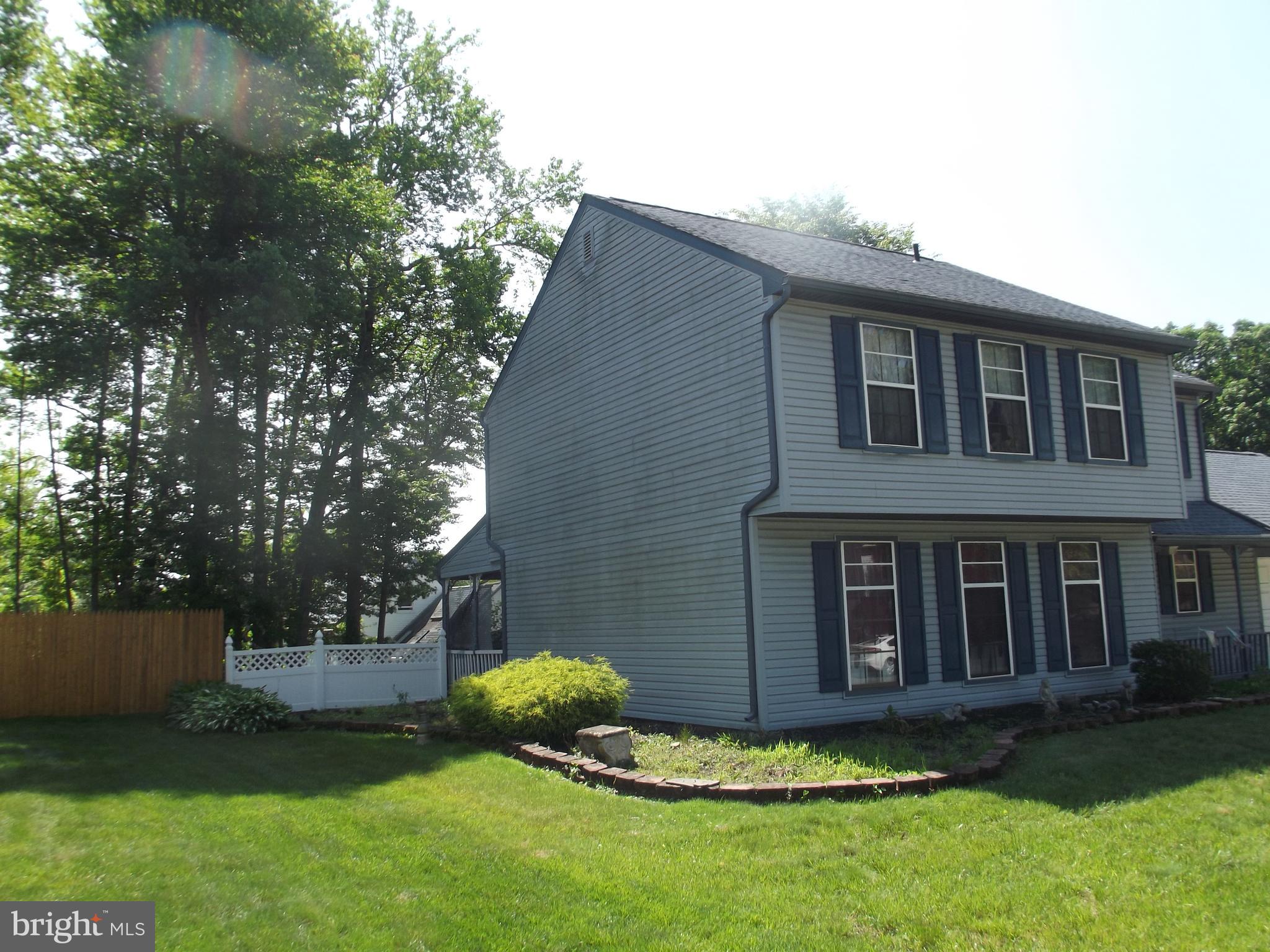 20 Devonshire Drive Westampton, NJ 08060 - Photo 6 of 7 a backyard of a house with a garden and plants