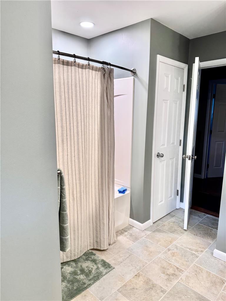 5334 Egypt Road Laurys Station, PA 18059 - Photo 20 of 55 Tiled flooring and bright overhead lighting define this practical and comfortable bathing space.