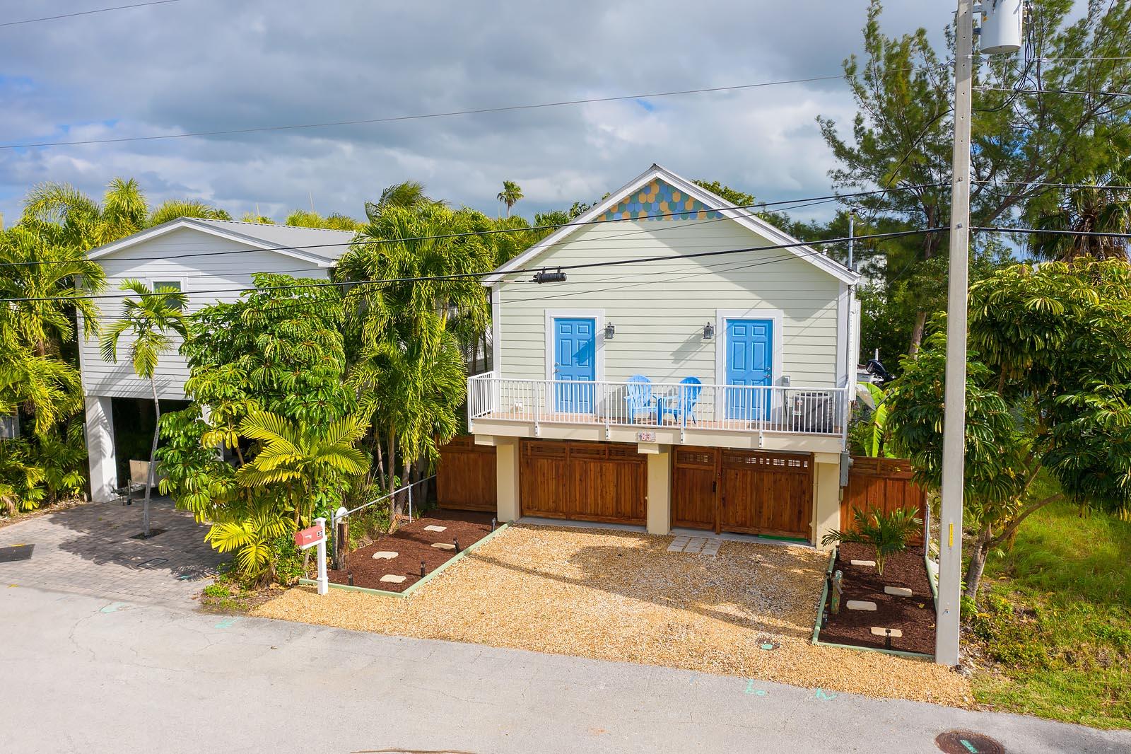 a view of a house with a yard and a porch