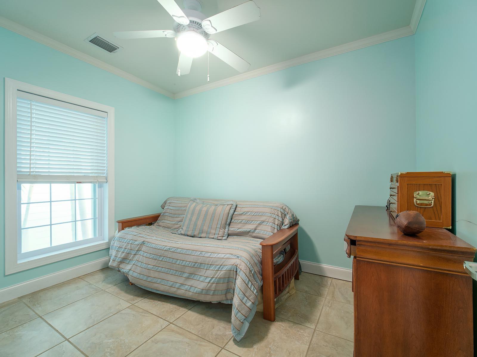 83 Palm Drive Key West, FL 33040 - Photo 14 of 35 a bedroom with a bed and window