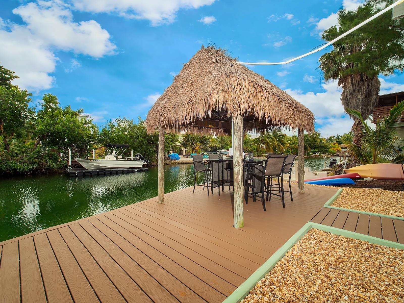 83 Palm Drive Key West, FL 33040 - Photo 17 of 35 a view of a swimming pool with a patio