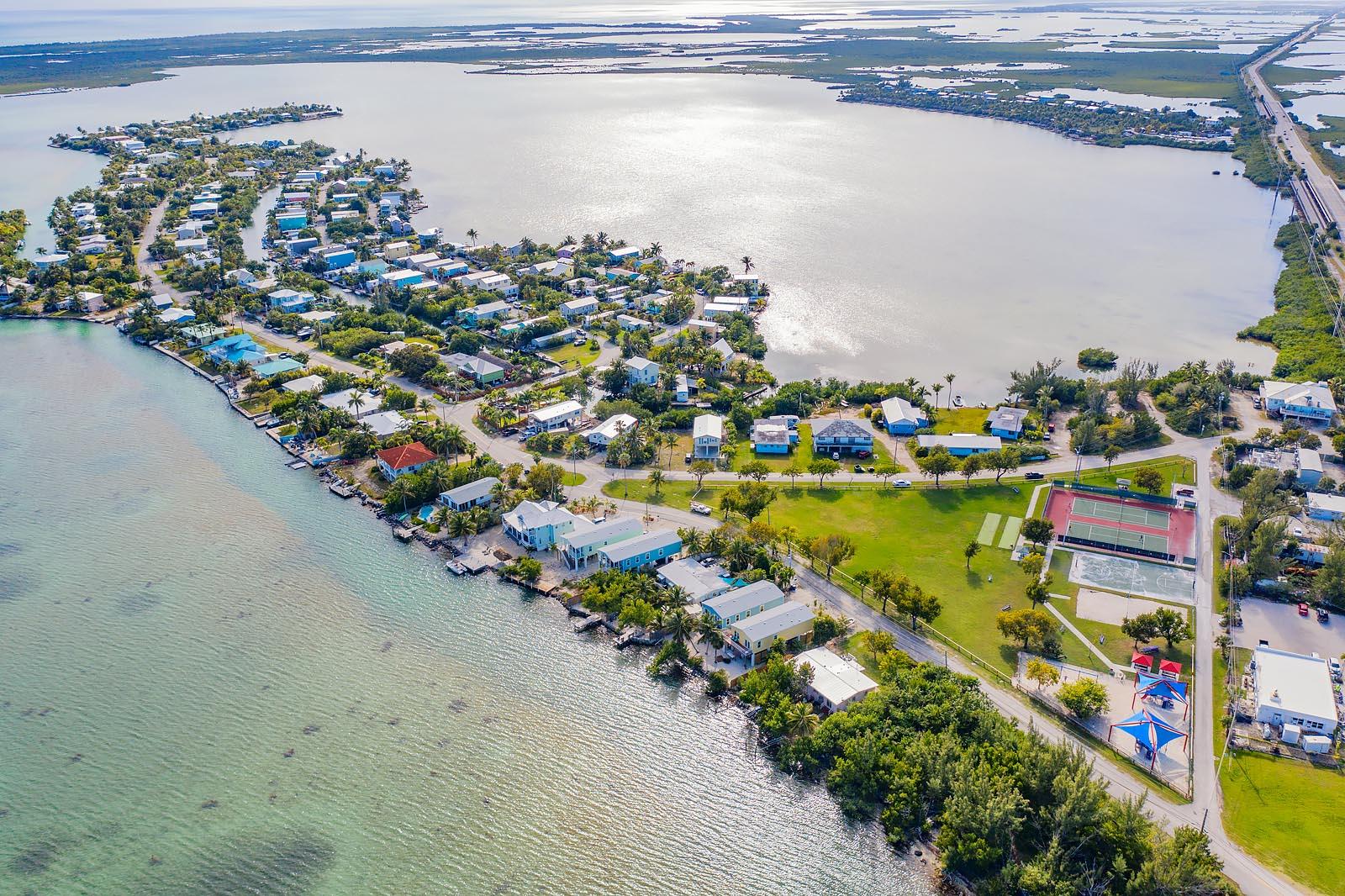 83 Palm Drive Key West, FL 33040 - Photo 31 of 35 a view of a lake with a table and chairs
