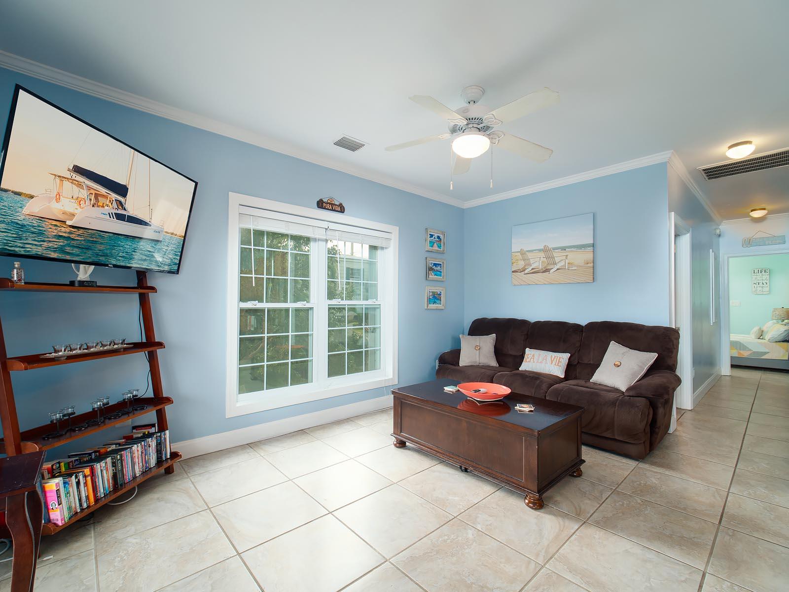 83 Palm Drive Key West, FL 33040 - Photo 7 of 35 a living room with furniture and a flat screen tv