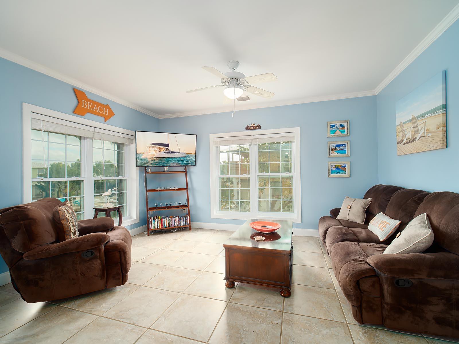 83 Palm Drive Key West, FL 33040 - Photo 8 of 35 a living room with furniture and a large window