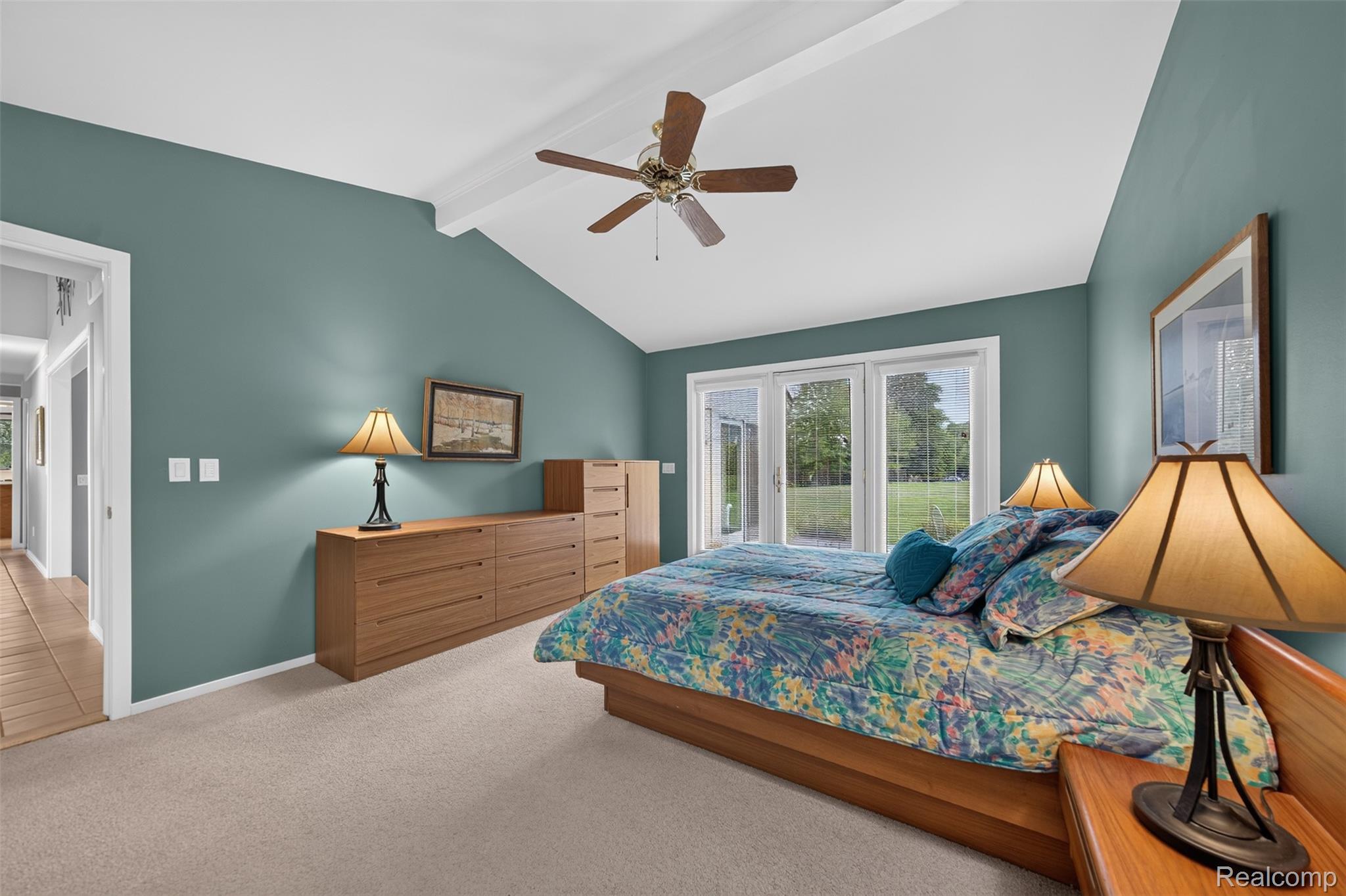 1236 Chaffer Drive Rochester, MI 48306 - Photo 30 of 76 Vaulted ceiling bedroom featuring multiple windows, a ceiling fan, and carpet flooring