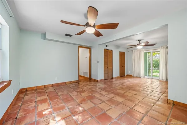 a view of an empty room with a window