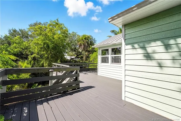 a view of balcony with wooden floor
