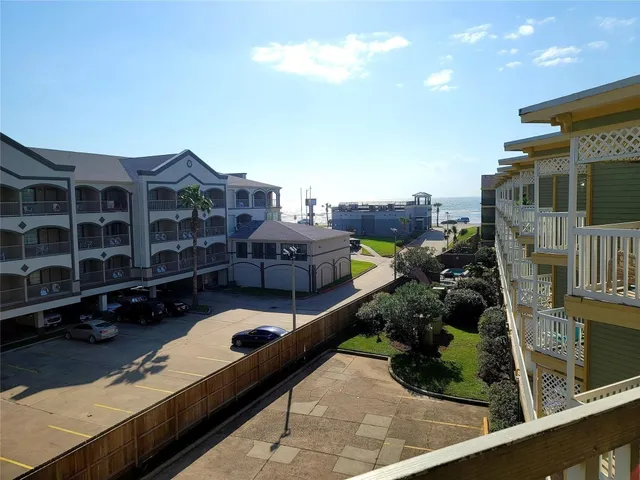 a view of a balcony with chairs