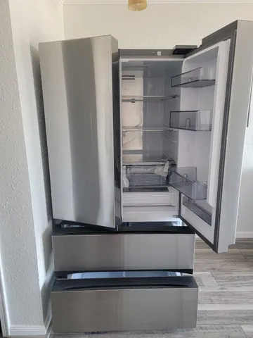 a view of walk in closet with empty racks