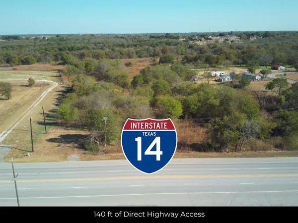 a view of a swimming pool with a yard