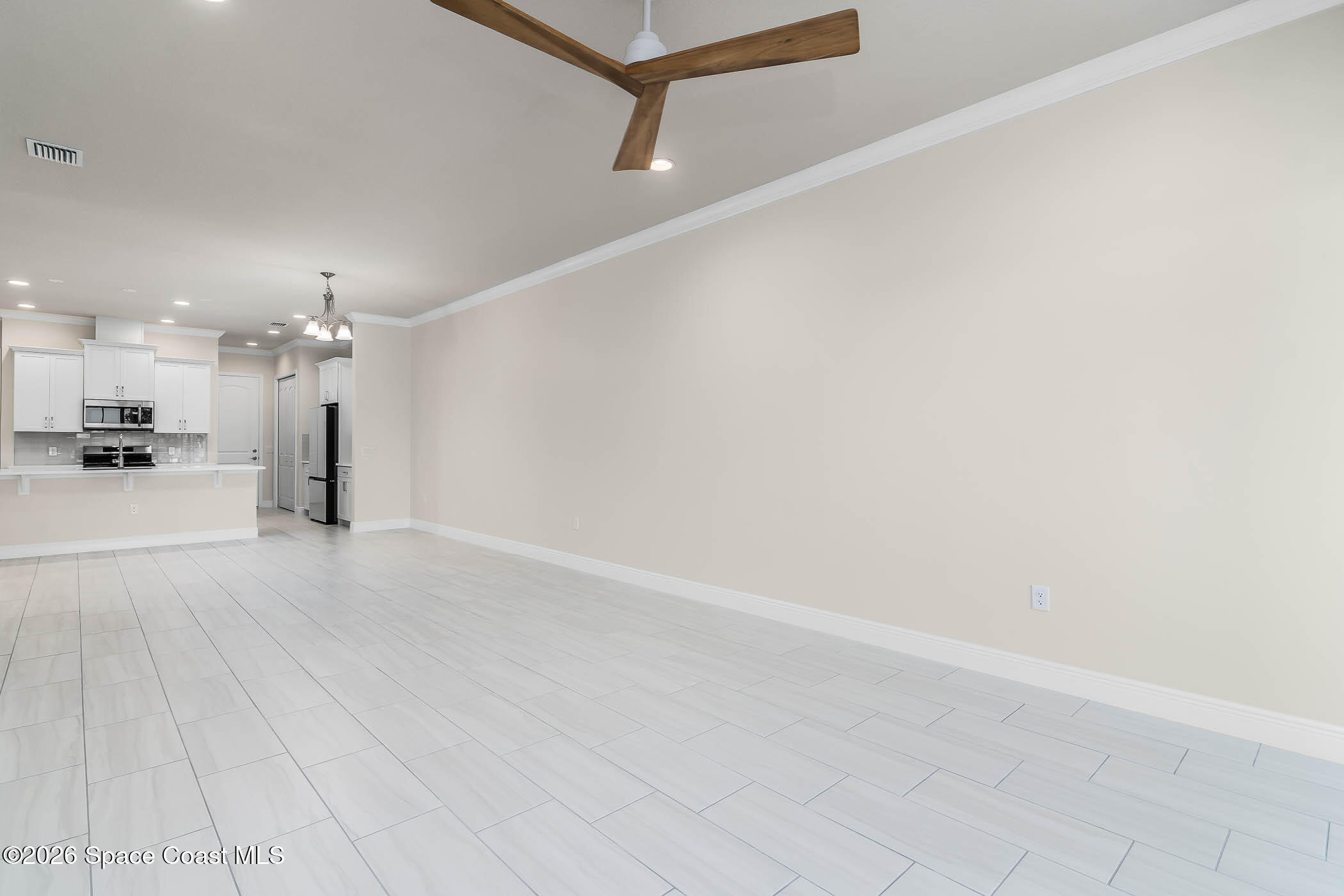 7929 Cache Crk Lane Melbourne, FL 32940 - Photo 17 of 45 a view of a room with a kitchen