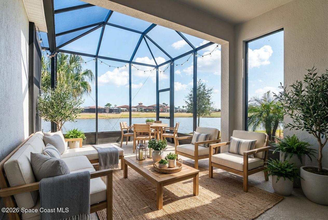 7929 Cache Crk Lane Melbourne, FL 32940 - Photo 2 of 45 a living room with furniture and a large window