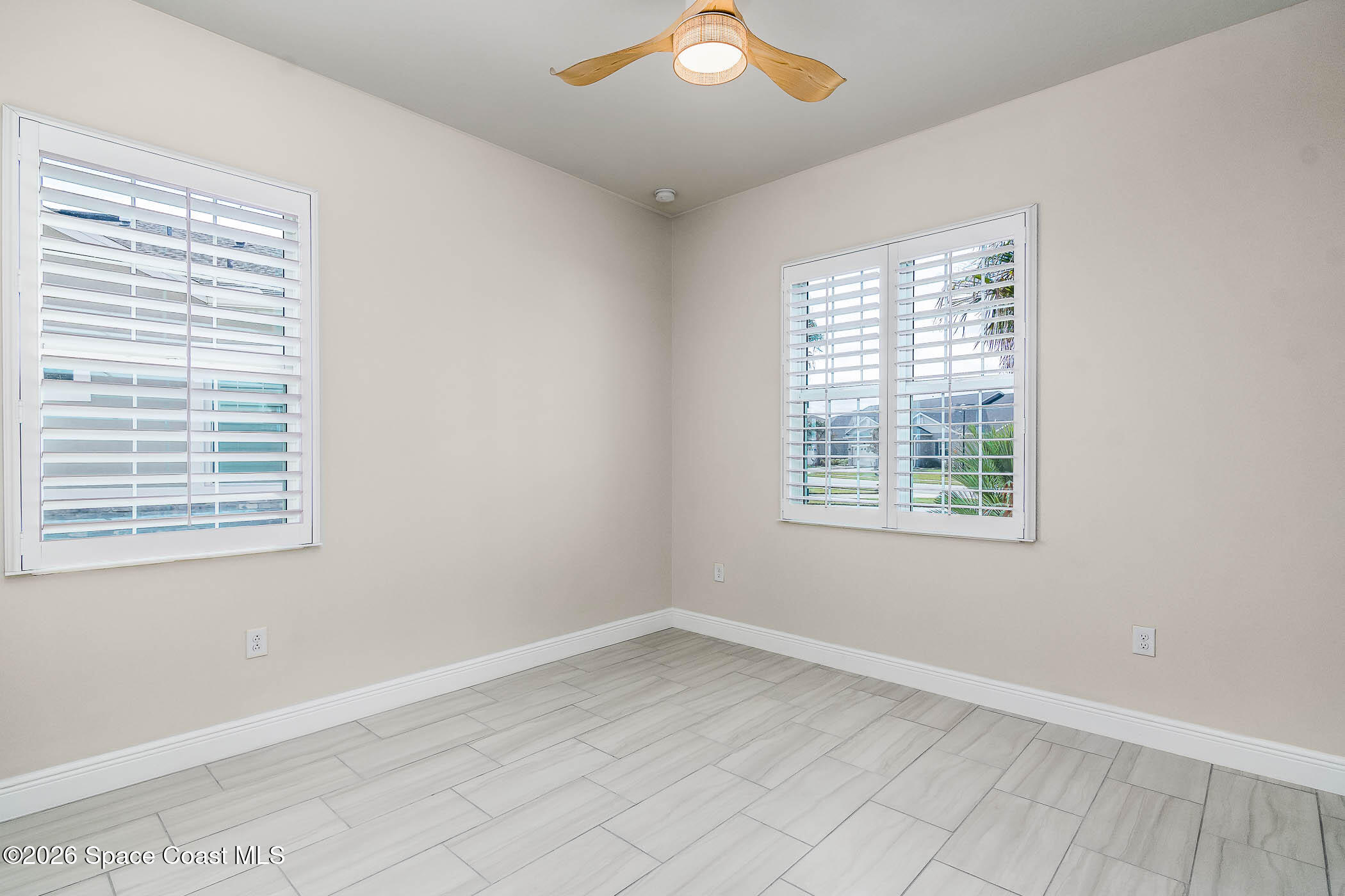 7929 Cache Crk Lane Melbourne, FL 32940 - Photo 22 of 45 an empty room with a window