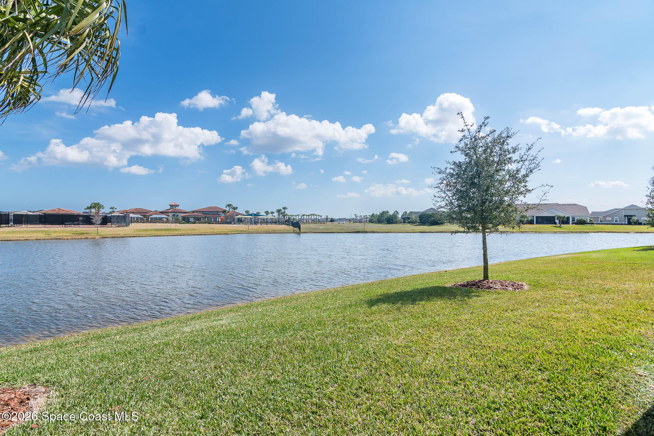 7929 Cache Crk Lane Melbourne, FL 32940 - Photo 24 of 45 a view of a lake with a big yard