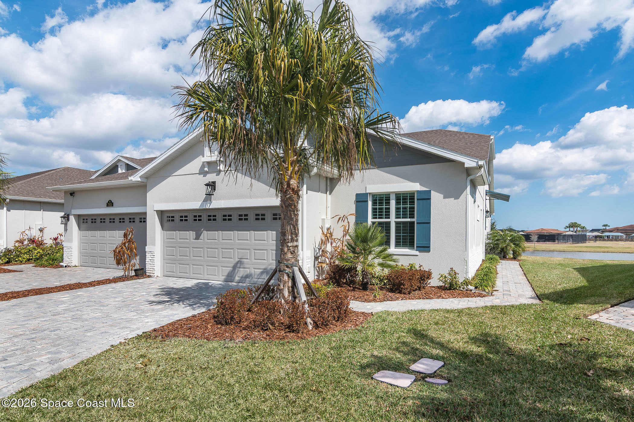 7929 Cache Crk Lane Melbourne, FL 32940 - Photo 28 of 45 a front view of a house with garden