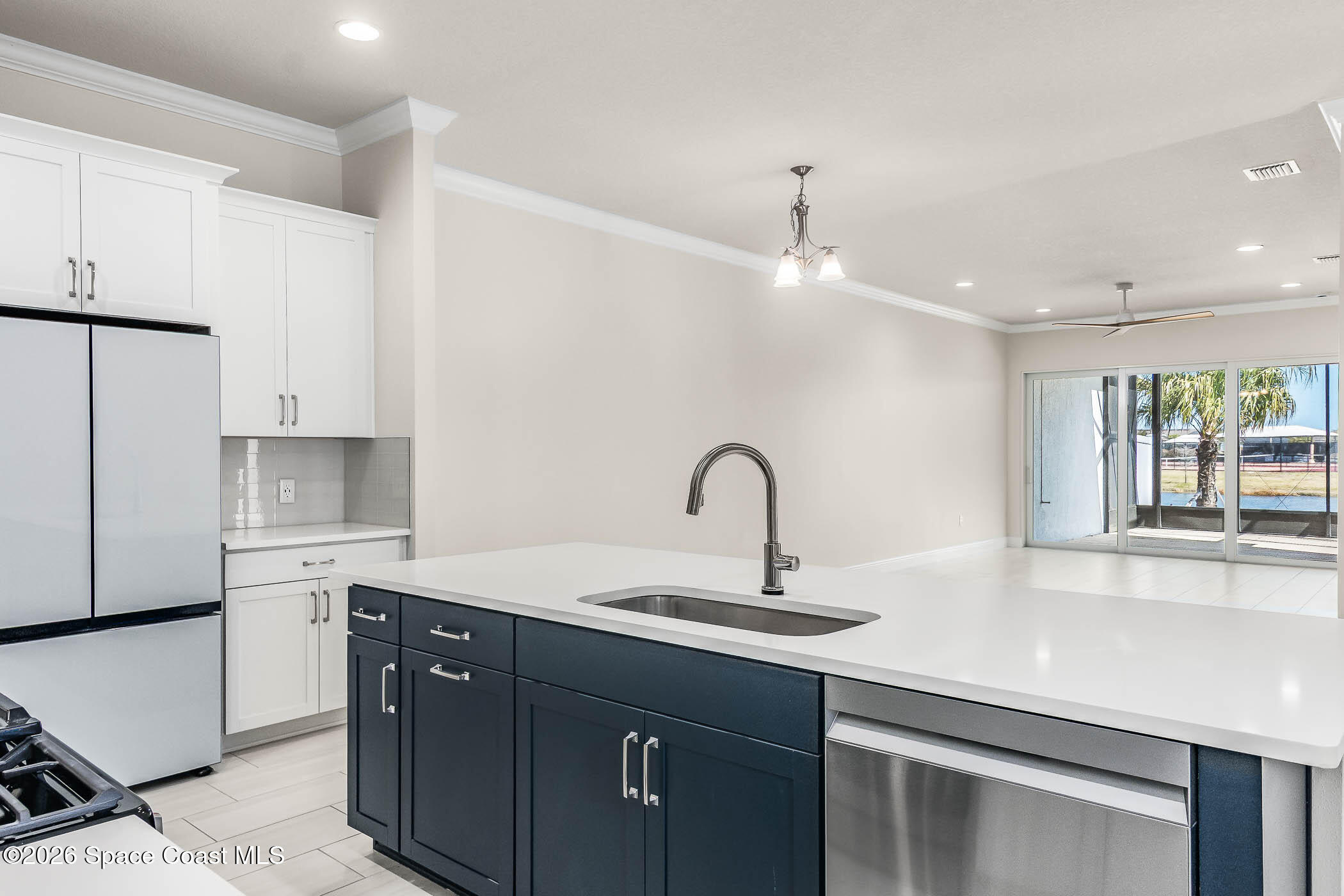 7929 Cache Crk Lane Melbourne, FL 32940 - Photo 3 of 45 a kitchen with a sink cabinets and window