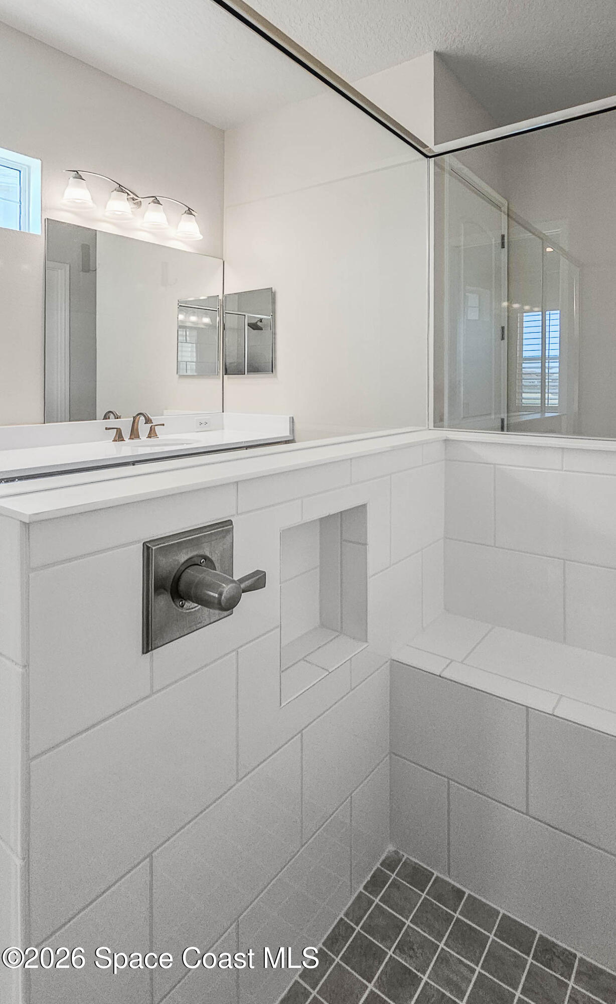 7929 Cache Crk Lane Melbourne, FL 32940 - Photo 31 of 45 a bathroom with a sink and mirror