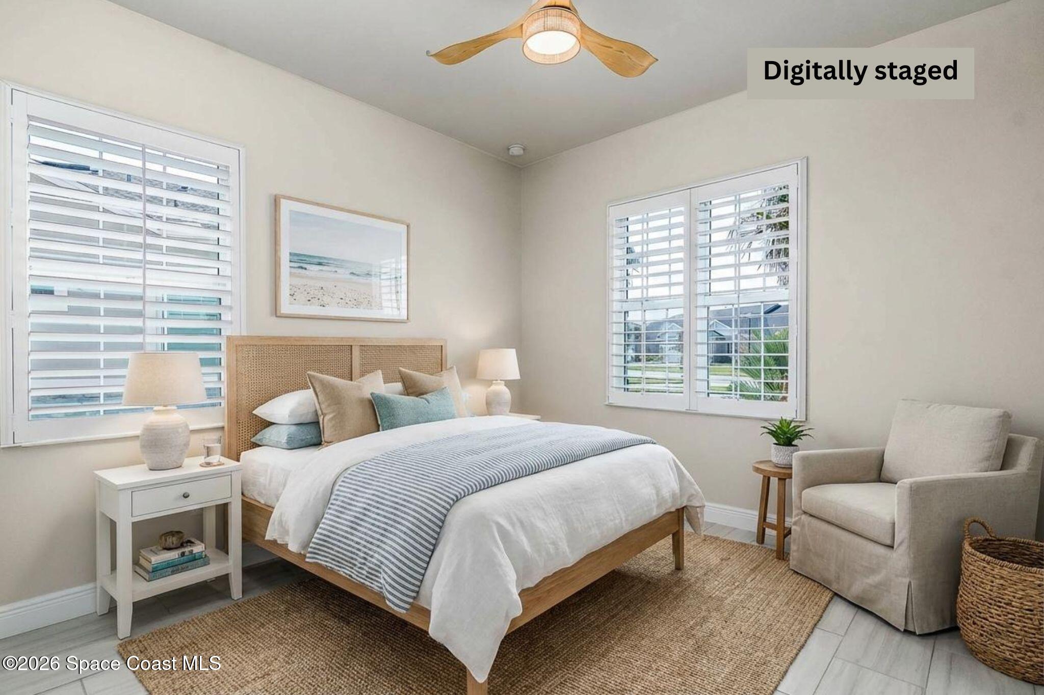 7929 Cache Crk Lane Melbourne, FL 32940 - Photo 35 of 45 a bedroom with a bed and a couch