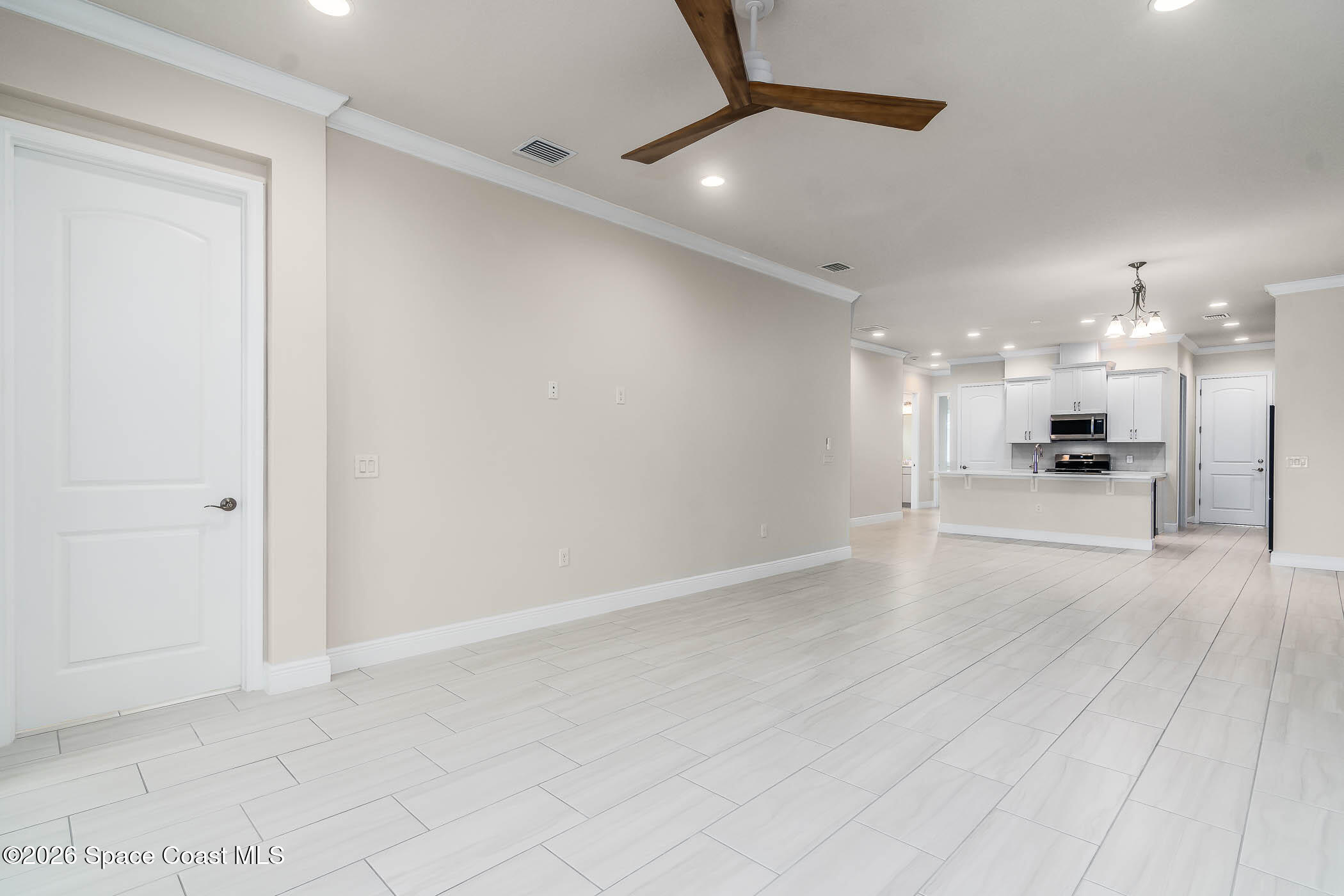 7929 Cache Crk Lane Melbourne, FL 32940 - Photo 45 of 45 a view of large kitchen with a refrigerator and a stove top oven