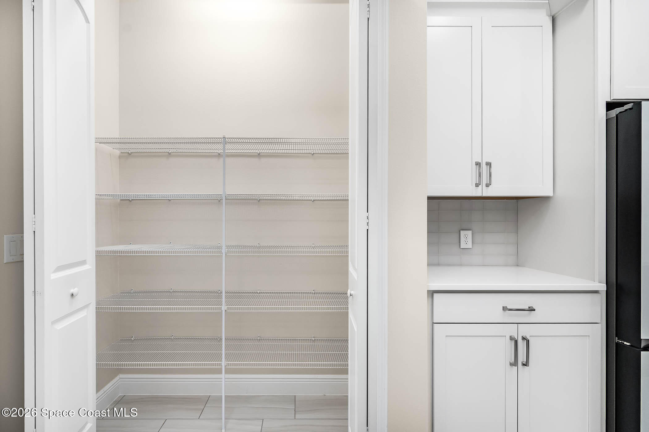 7929 Cache Crk Lane Melbourne, FL 32940 - Photo 5 of 45 a view of an empty walk in closet