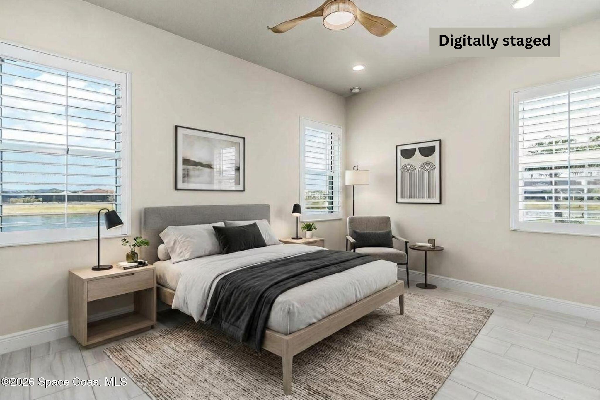 7929 Cache Crk Lane Melbourne, FL 32940 - Photo 6 of 45 a bedroom with a bed and a night stand