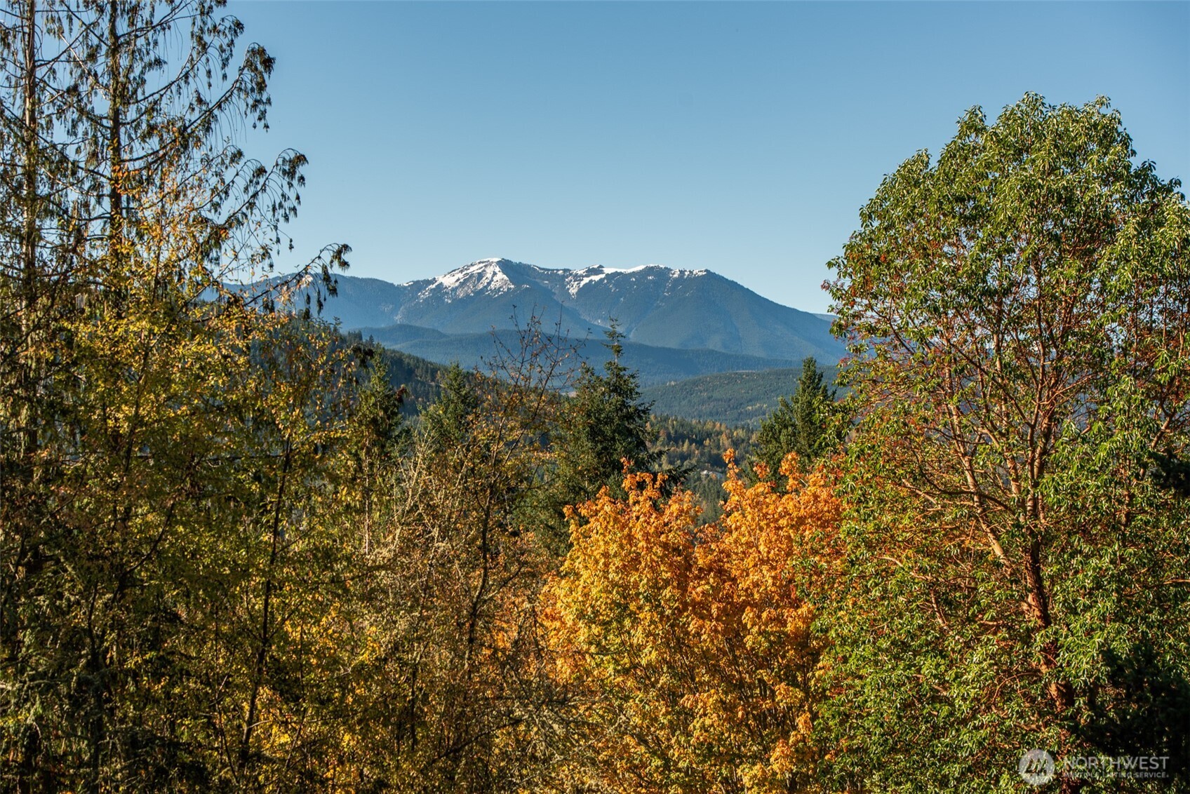 1051 Fox Hollow Road Sequim, WA 98382 - Photo 37 of 40 a view of a house with a mountain in the background