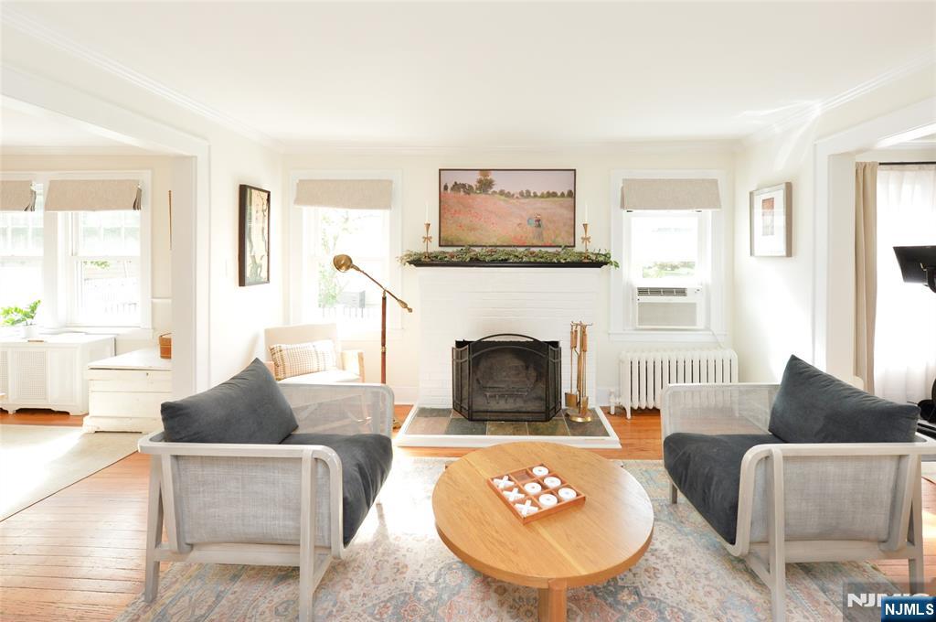 570 Shelton Road Ridgewood, NJ 07450 - Photo 5 of 26 a living room with furniture and a fireplace